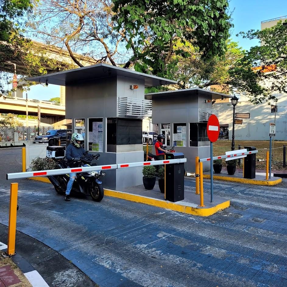 Manned exit booths with barrier gates