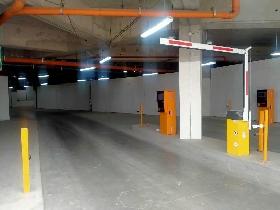 Parking entrance with barrier gate at NU Star Cebu
